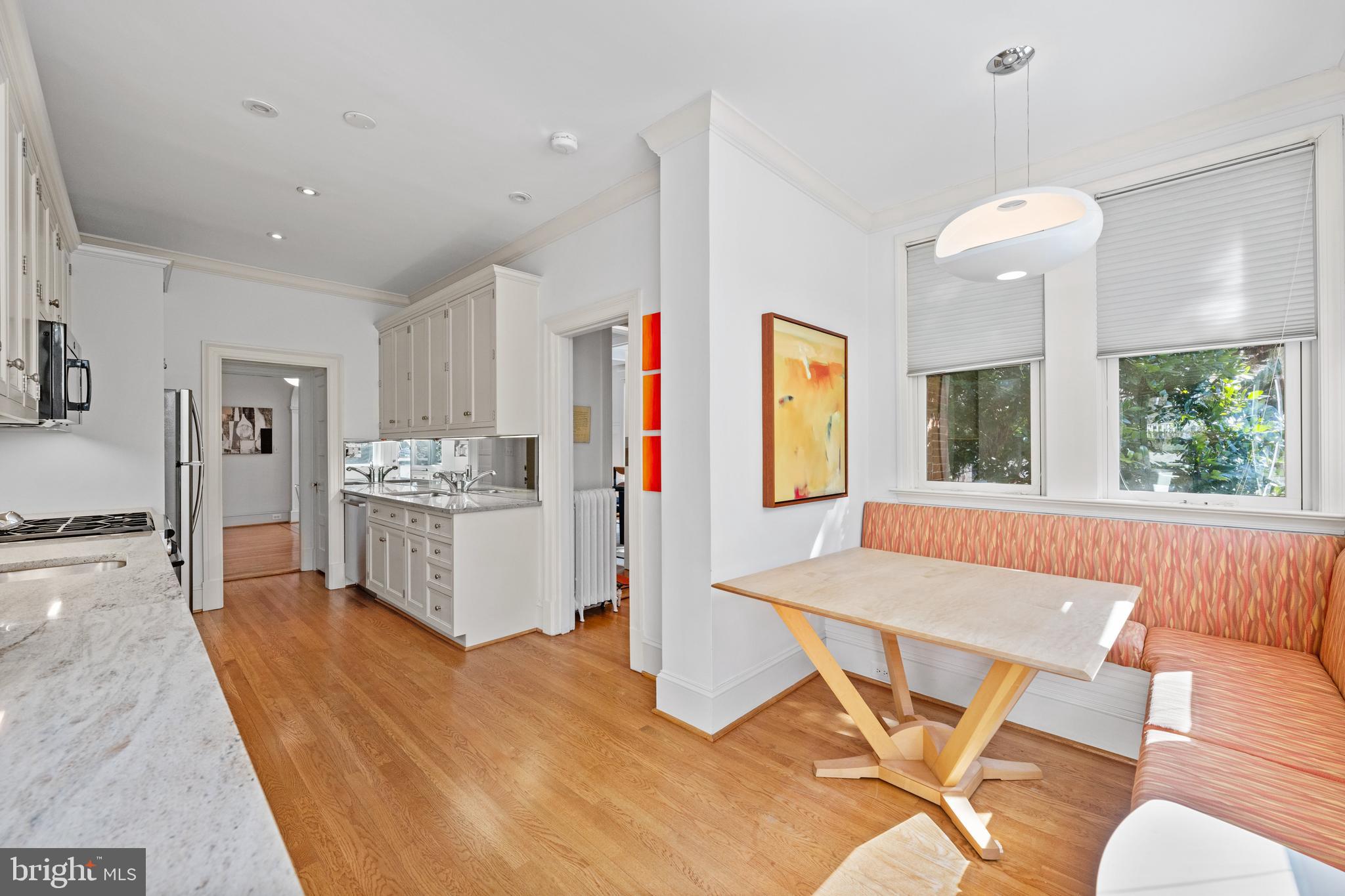 2862 28th Street Northwest Washington, DC 20008 - Photo 9 of 26 a living room with kitchen island furniture and a chandelier