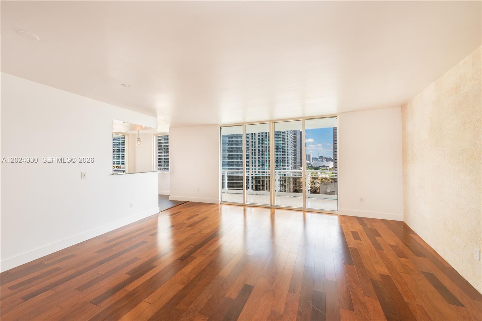 901 Brickell Key Boulevard, Unit 2006 Miami, FL 33131 - Photo 11 of 41 Living / Dining - Wood Floors - W/Out Stage
