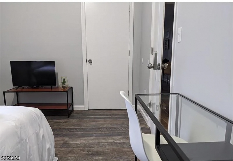 16 Alexander Street, Unit 2 Newark, NJ 07106 - Photo 2 of 8 a living room with furniture and a flat screen tv