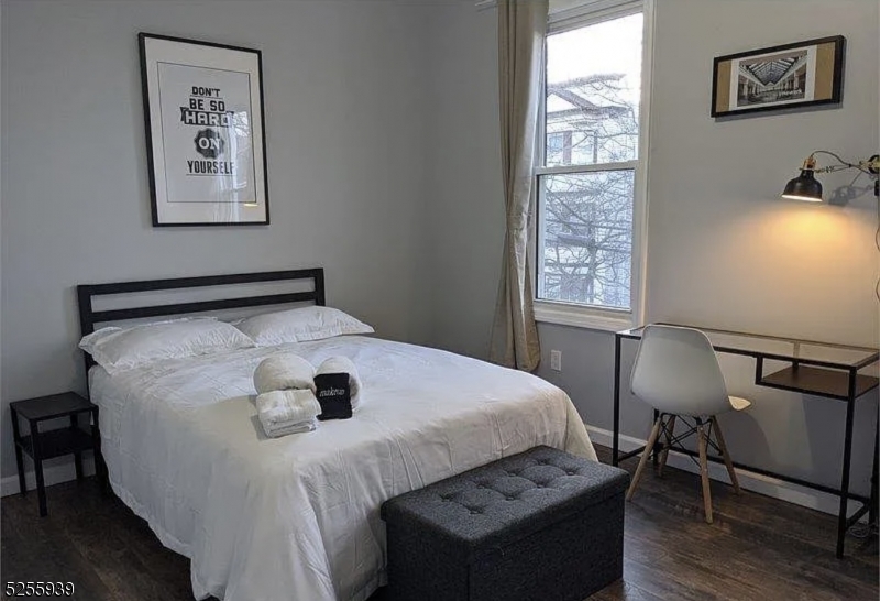 16 Alexander Street, Unit 2 Newark, NJ 07106 - Photo 3 of 8 a bedroom with a bed and a window