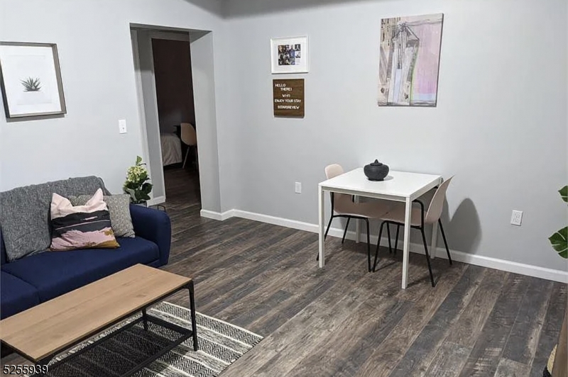 16 Alexander Street, Unit 2 Newark, NJ 07106 - Photo 4 of 8 a living room with furniture and a wooden floor