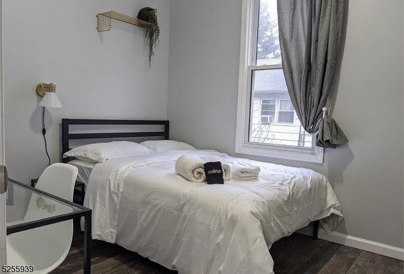 16 Alexander Street, Unit 2 Newark, NJ 07106 - Photo 5 of 8 a bedroom with a bed and a window