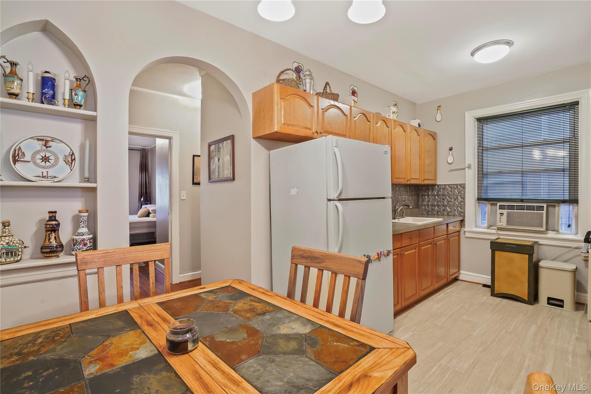 43-06 57th Street Queens, NY 11377 - Photo 16 of 21 a bedroom with furniture wooden floor and window