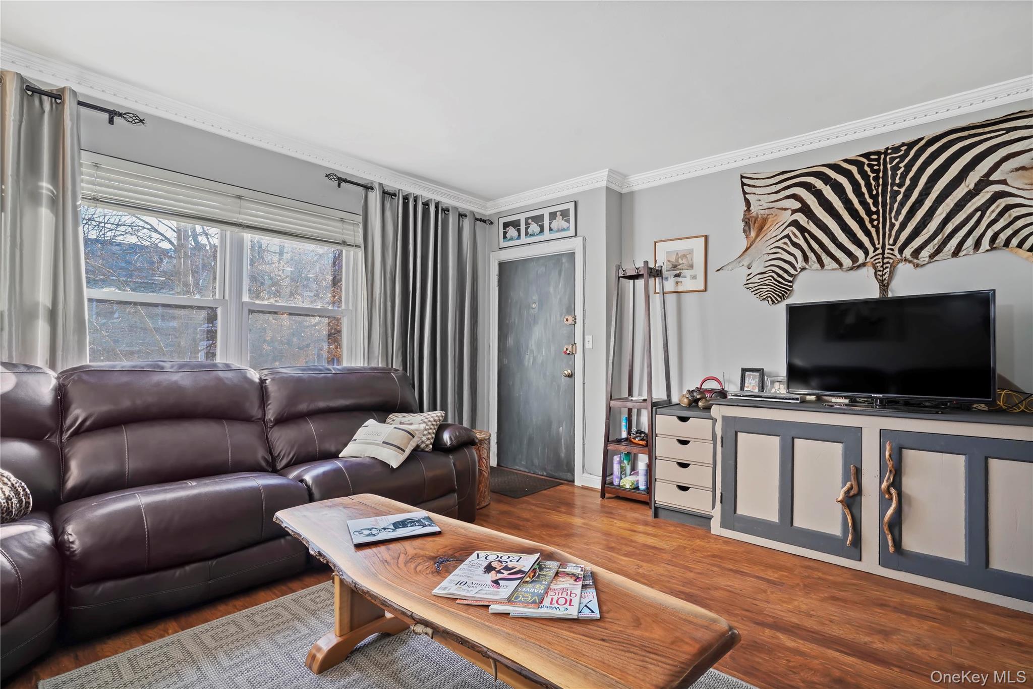 43-06 57th Street Queens, NY 11377 - Photo 21 of 21 a living room with furniture and a flat screen tv