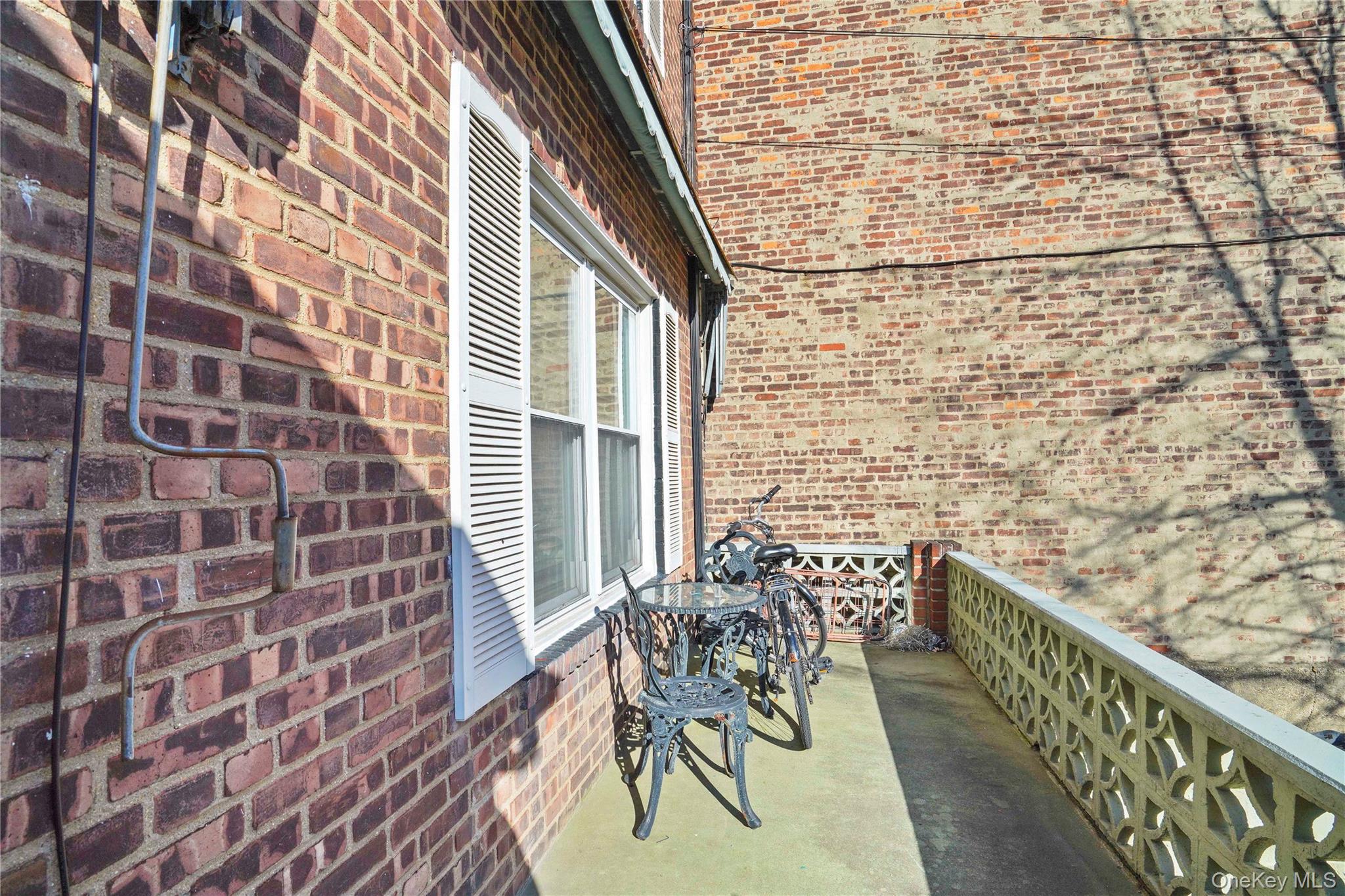 43-06 57th Street Queens, NY 11377 - Photo 4 of 21 a balcony with wooden floor