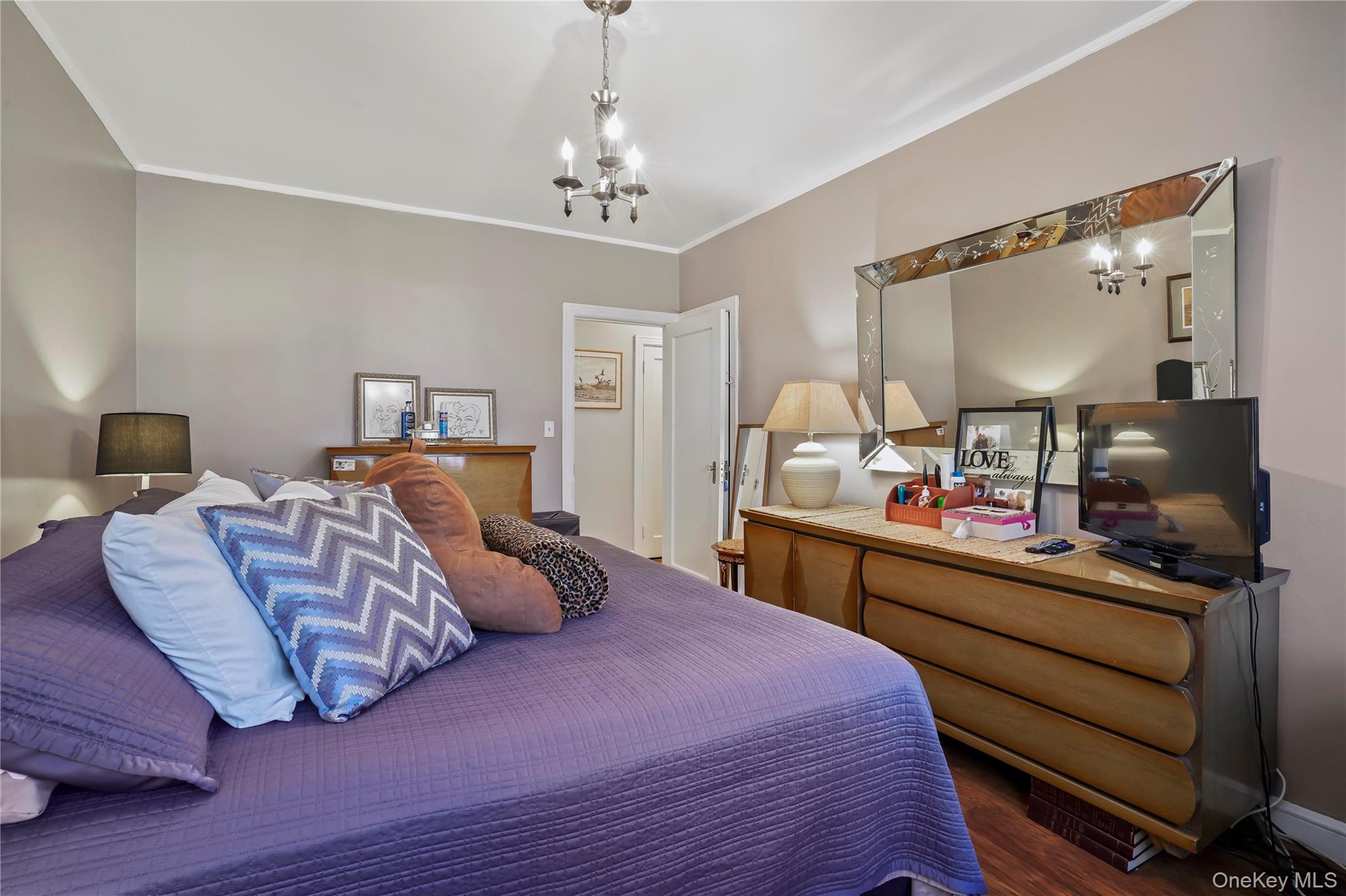 43-06 57th Street Queens, NY 11377 - Photo 5 of 21 a bedroom with bed and window