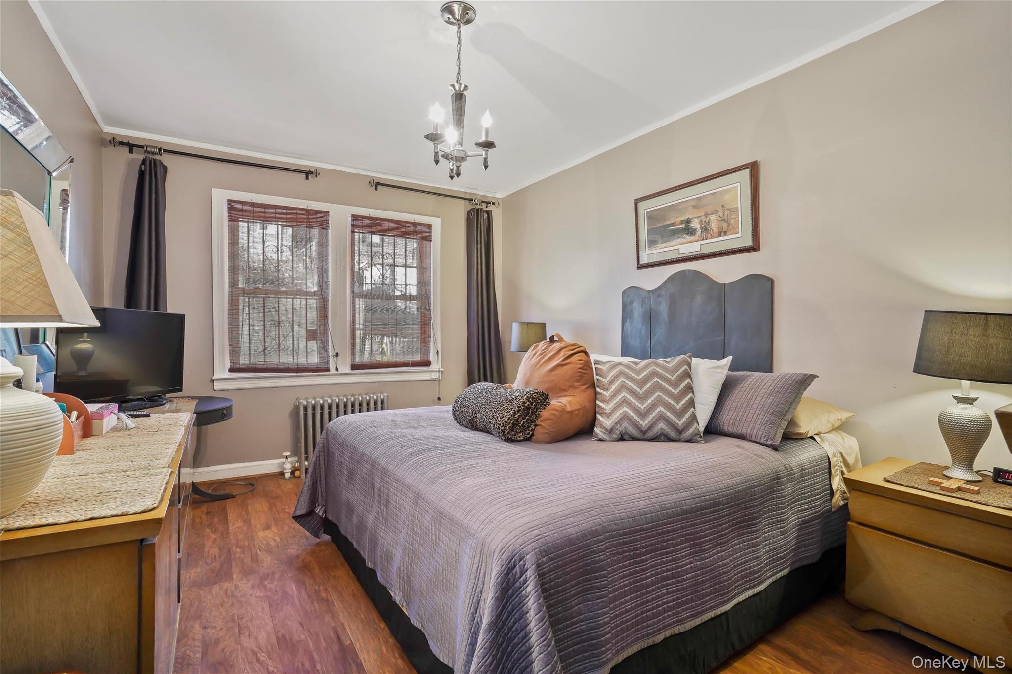 43-06 57th Street Queens, NY 11377 - Photo 7 of 21 a bedroom with a bed and a couch