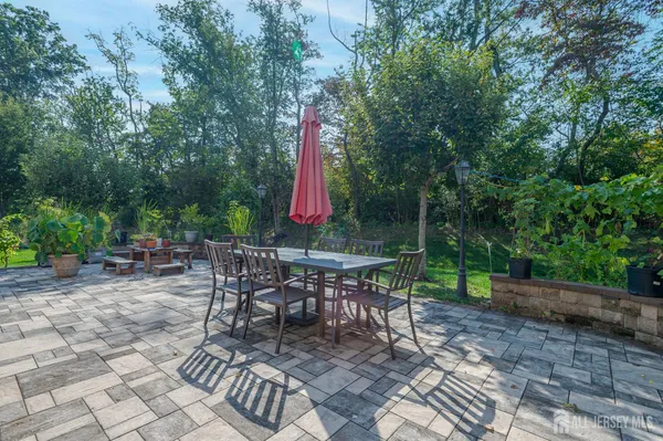 a view of a sitting area with furniture and wooden fence