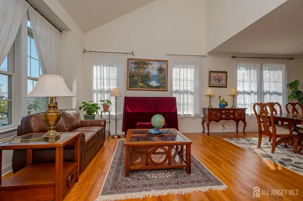 a living room with furniture and a rug
