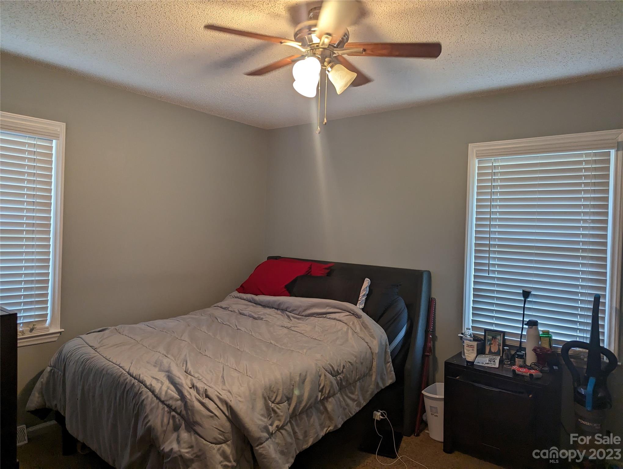 3525 Hickory Place Salisbury, NC 28144 - Photo 11 of 33 a bedroom with a bed and a chandelier