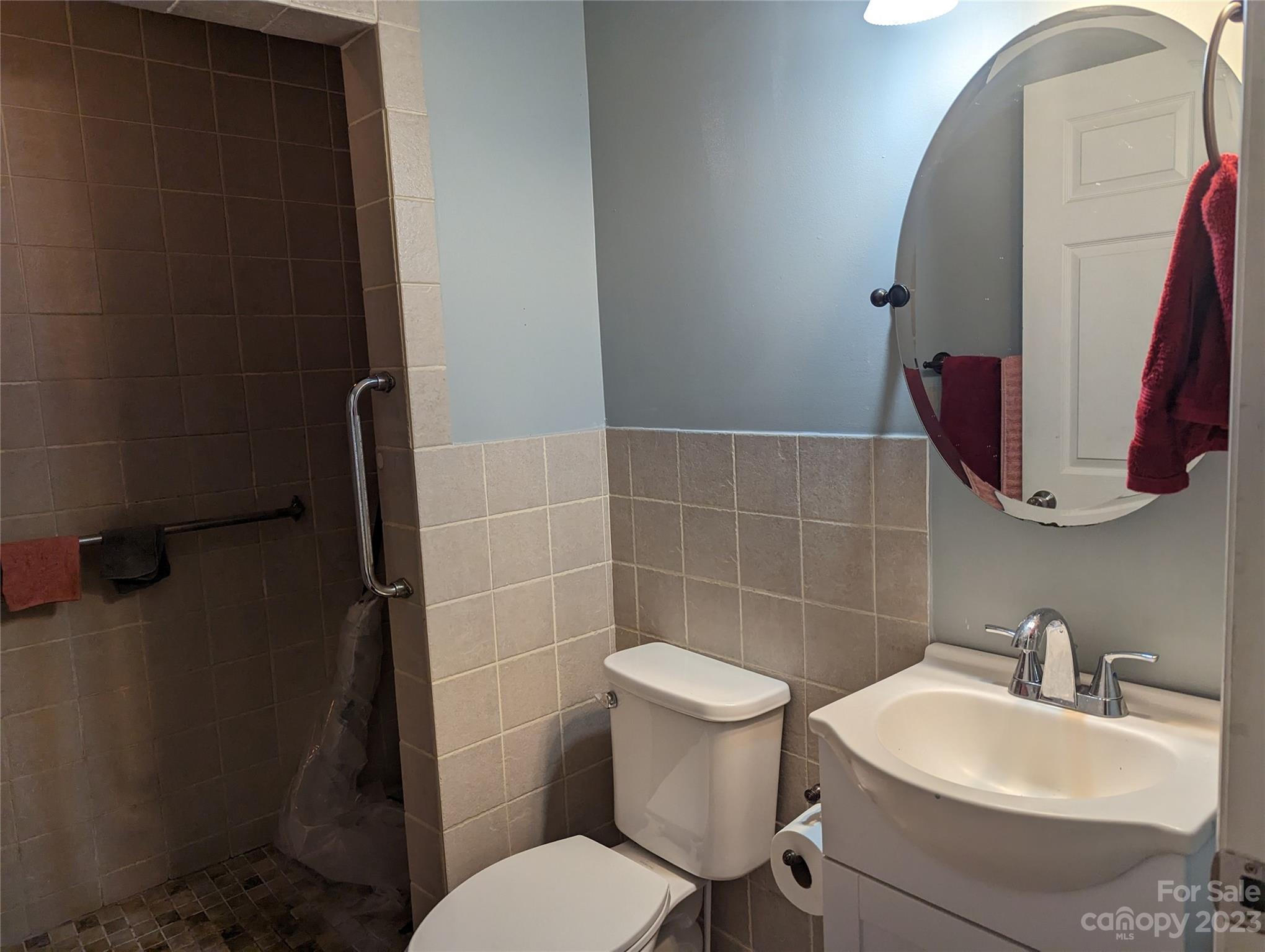 3525 Hickory Place Salisbury, NC 28144 - Photo 14 of 33 a bathroom with a toilet sink and mirror