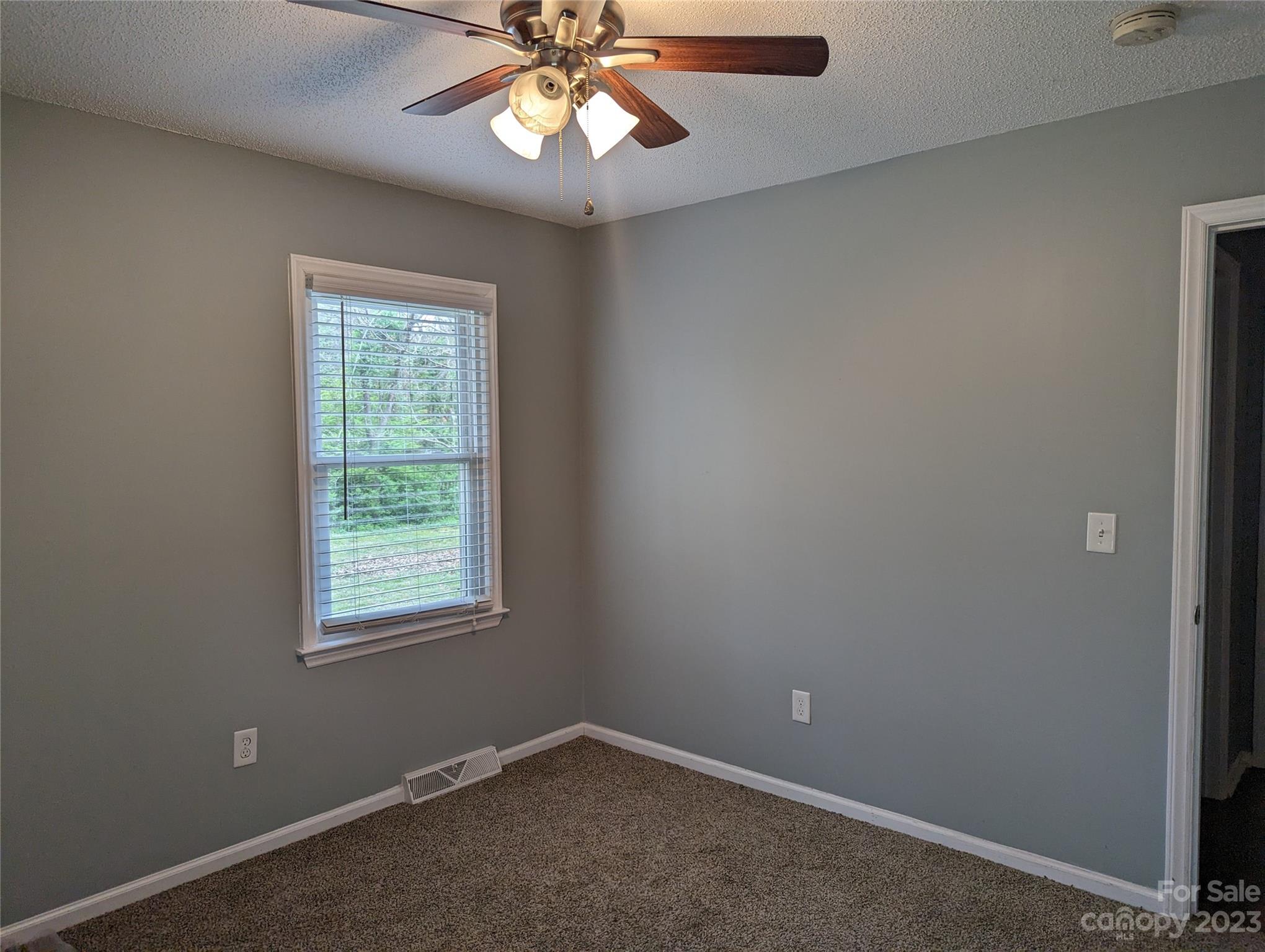 3525 Hickory Place Salisbury, NC 28144 - Photo 16 of 33 an empty room with a window and a fan