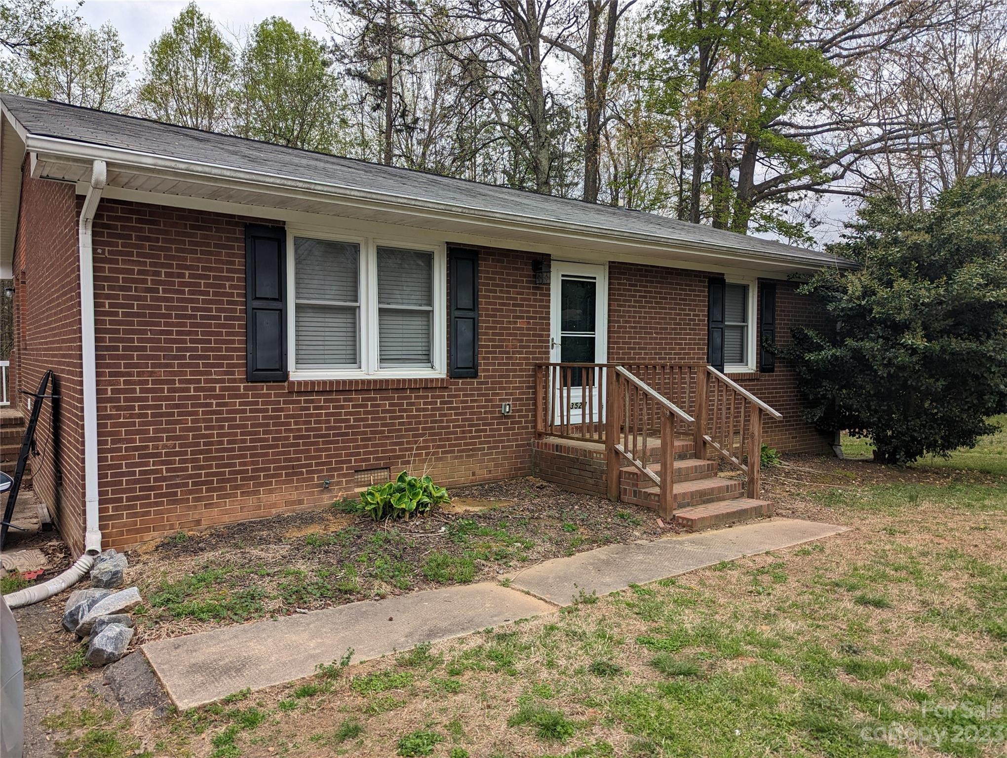 3525 Hickory Place Salisbury, NC 28144 - Photo 2 of 33 a house with trees in the background