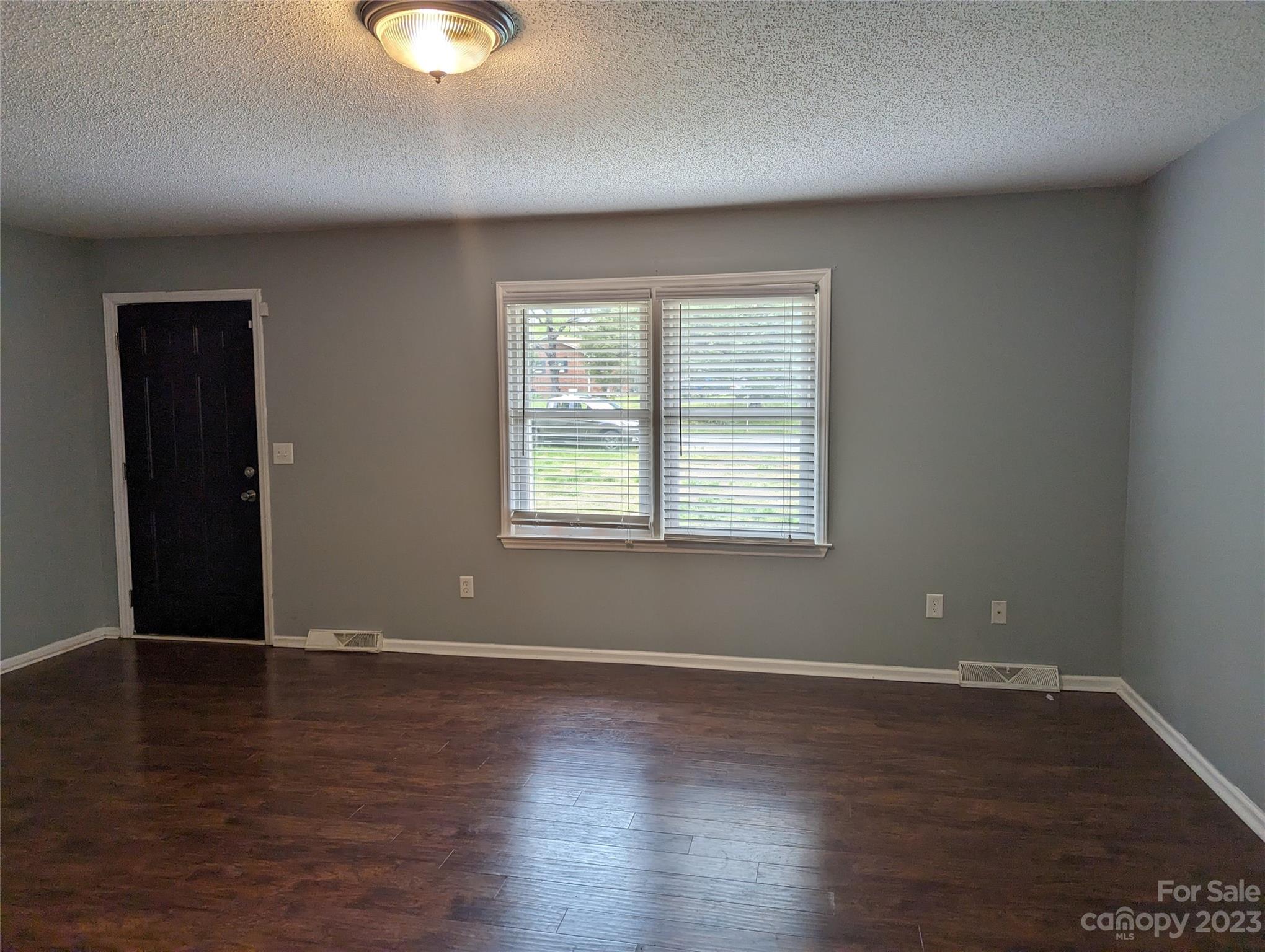 3525 Hickory Place Salisbury, NC 28144 - Photo 4 of 33 an empty room with wooden floor and windows
