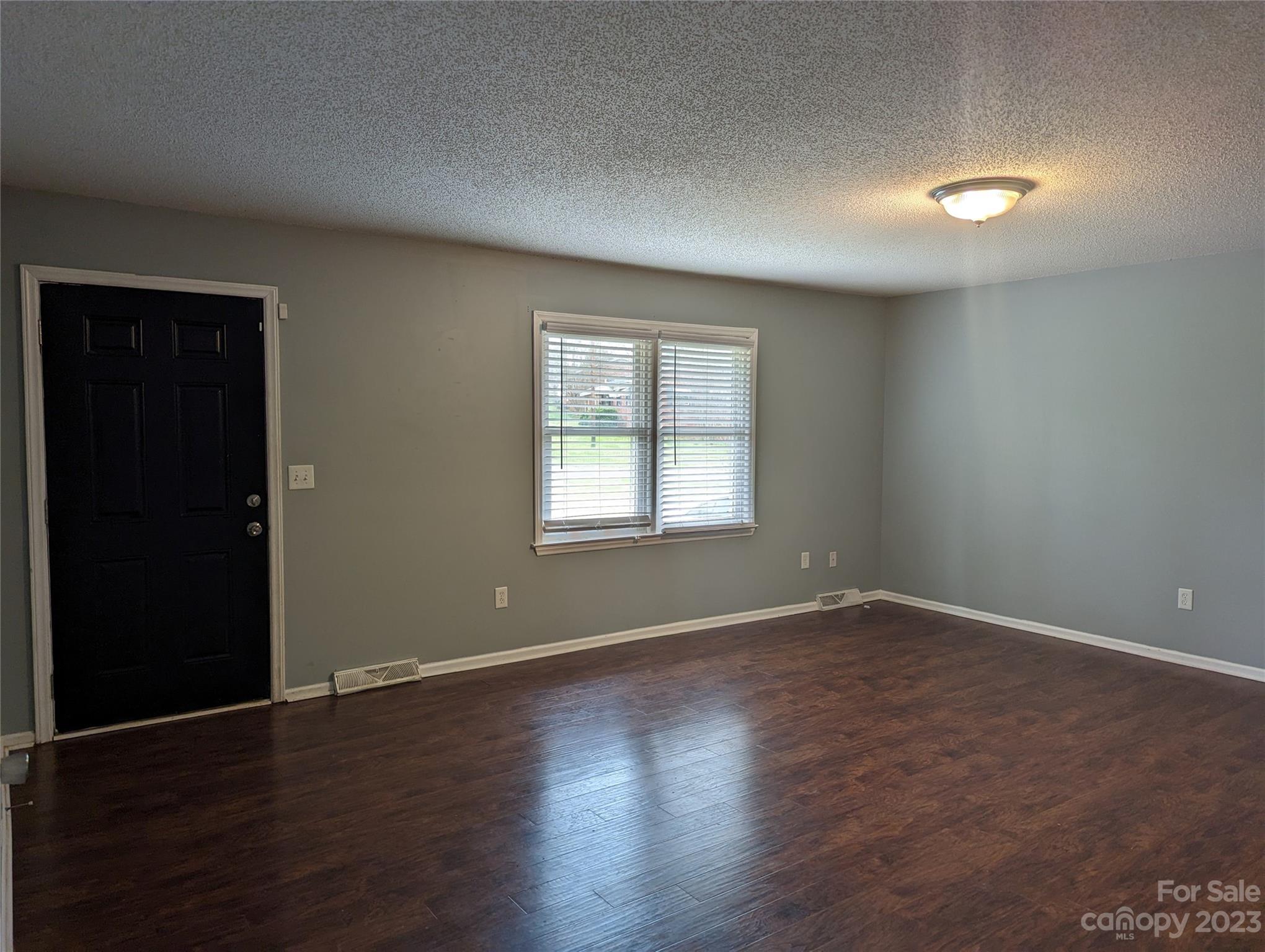3525 Hickory Place Salisbury, NC 28144 - Photo 5 of 33 an empty room with wooden floor and windows