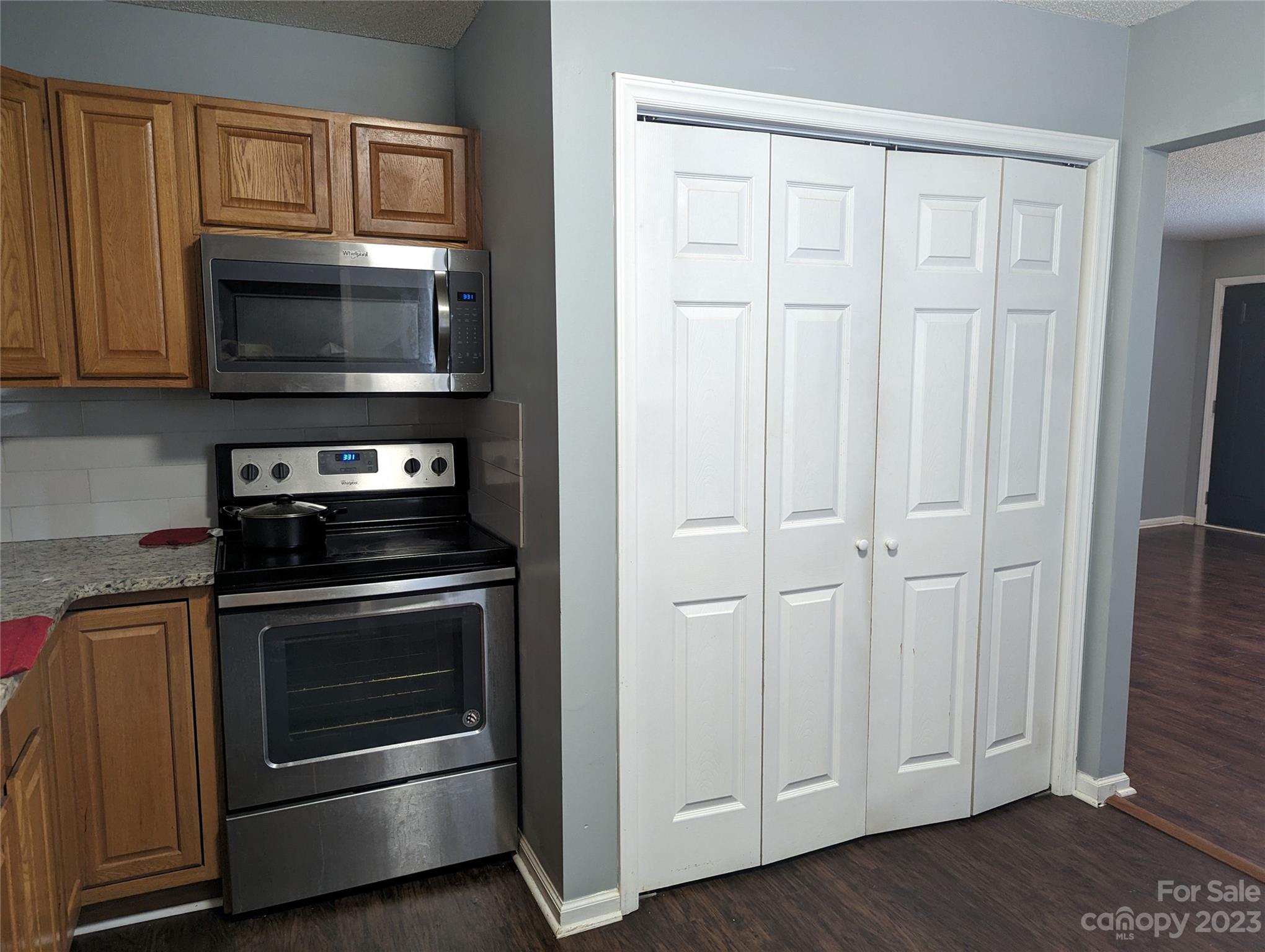 3525 Hickory Place Salisbury, NC 28144 - Photo 7 of 33 a kitchen with stainless steel appliances wooden cabinets and a stove top oven