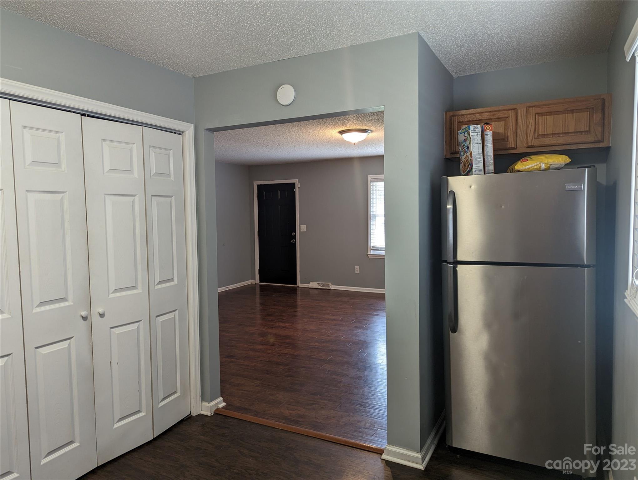 3525 Hickory Place Salisbury, NC 28144 - Photo 8 of 33 a view of a refrigerator in kitchen and wooden floor