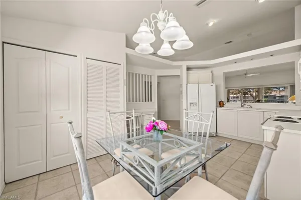 a kitchen with a stove sink and cabinets