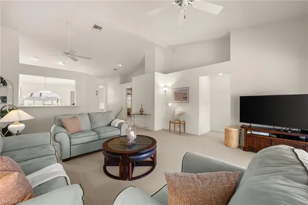 a living room with furniture white walls and white walls