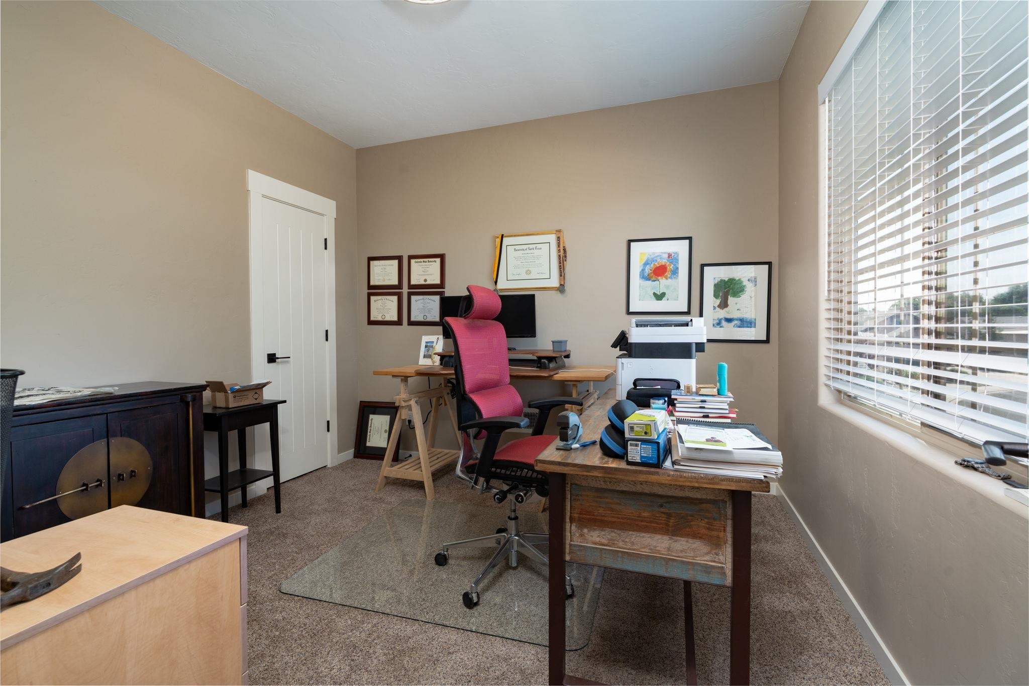 1139 Aspen Village Loop Fruita, CO 81521 - Photo 13 of 21 a living room with furniture and a window
