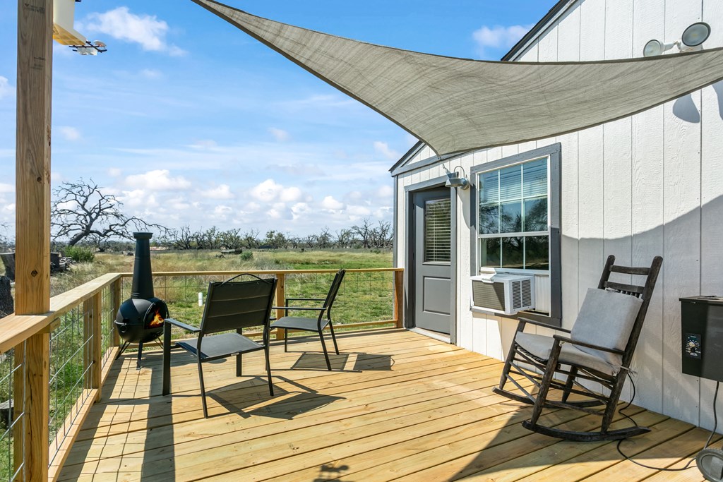 3527 Old Harper Road Fredericksburg, TX 78624 - Photo 17 of 43 a patio with glass top table and chairs