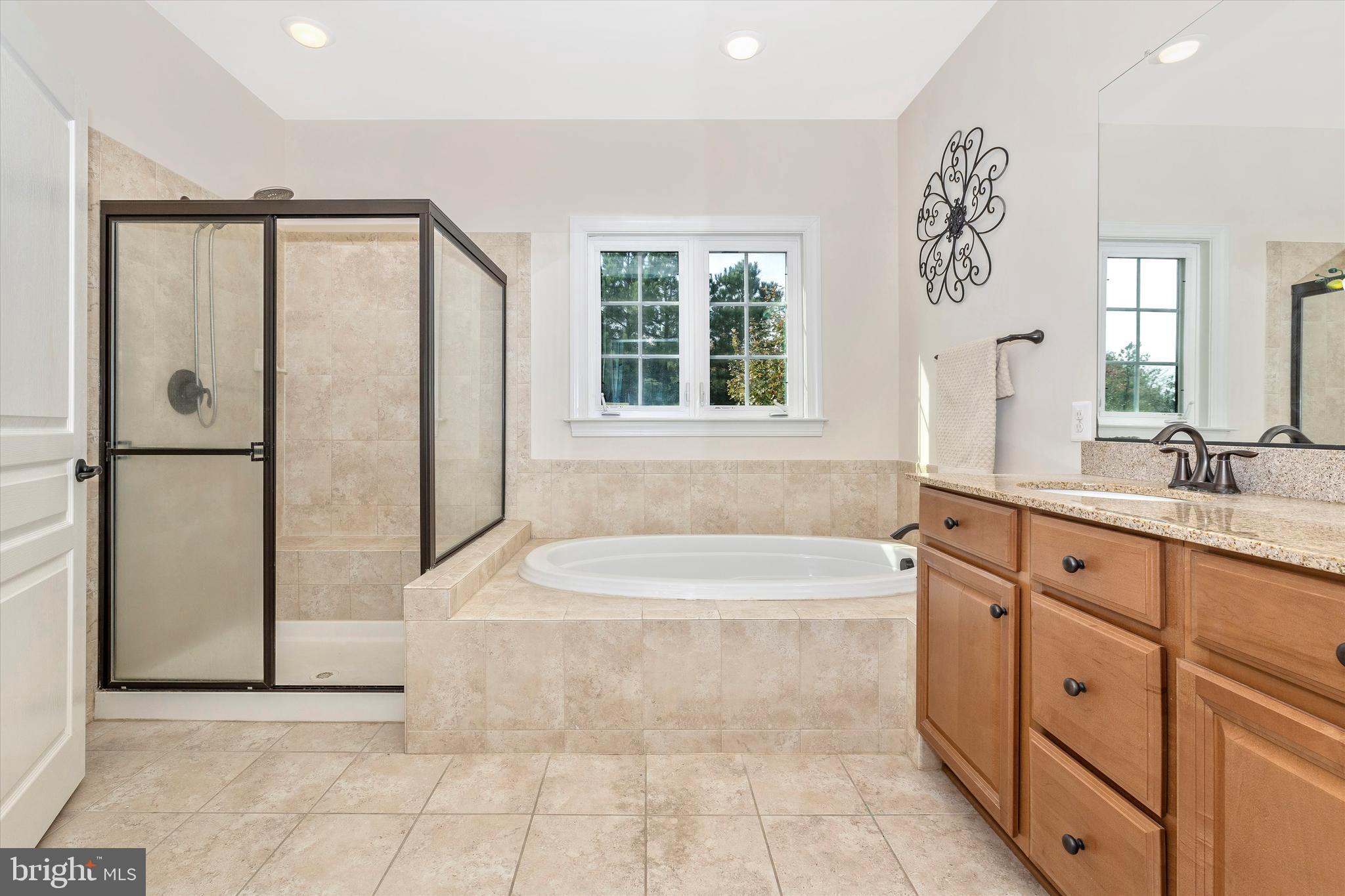 9733 Braidwood Terrace Frederick, MD 21704 - Photo 32 of 50 Separate shower & dual sinks w/Granite tops