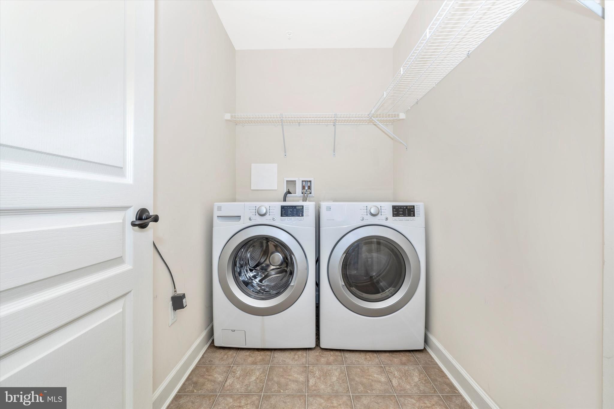 9733 Braidwood Terrace Frederick, MD 21704 - Photo 9 of 50 Front Loading washer & dryer & clothing racks