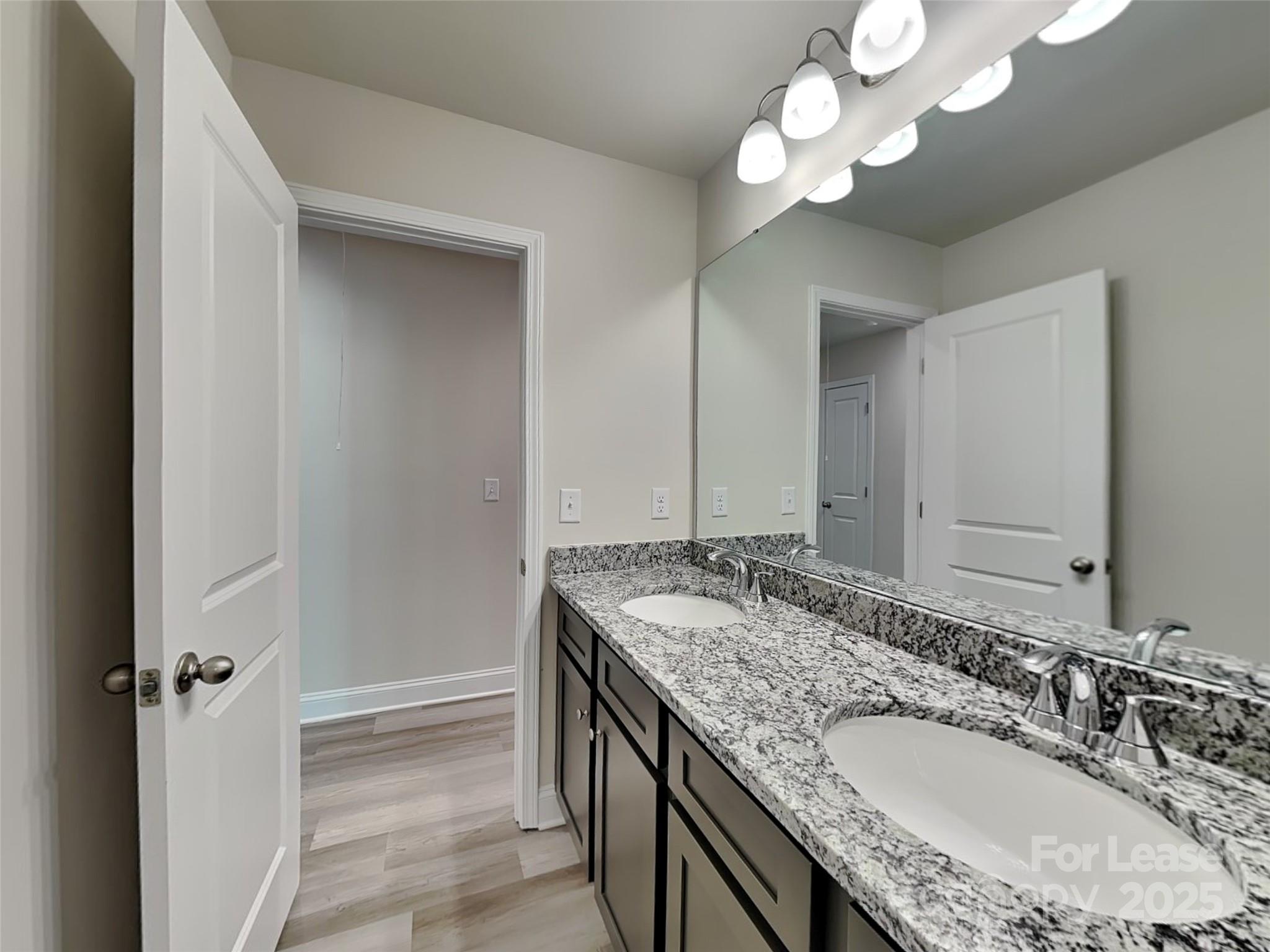 212 Queenshall Road Mooresville, NC 28117 - Photo 13 of 15 a bathroom with a granite countertop double vanity sink and a mirror