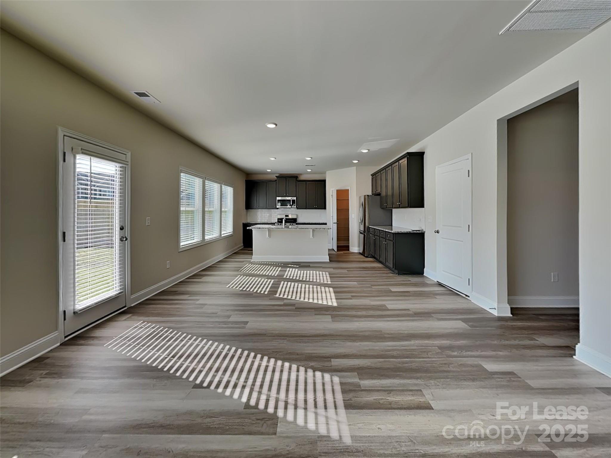 212 Queenshall Road Mooresville, NC 28117 - Photo 3 of 15 a view of kitchen with furniture and window