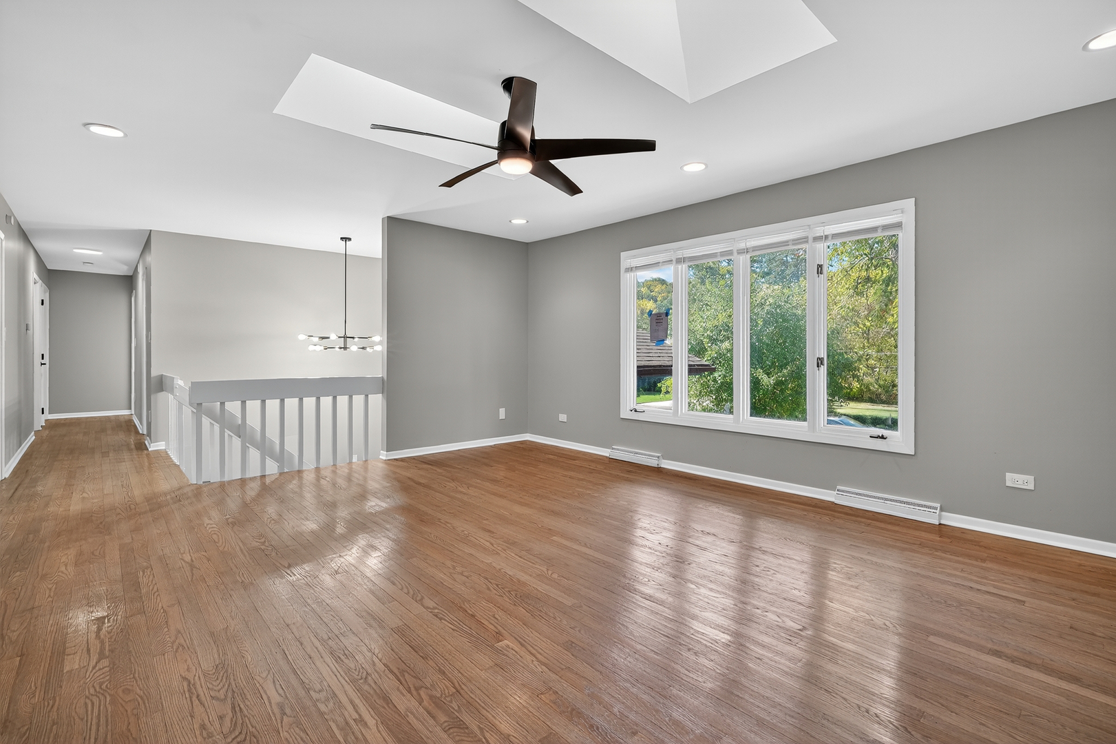 1245 Winaki Trail Algonquin, IL 60102 - Photo 12 of 39 a view of an empty room with wooden floor closet and a window