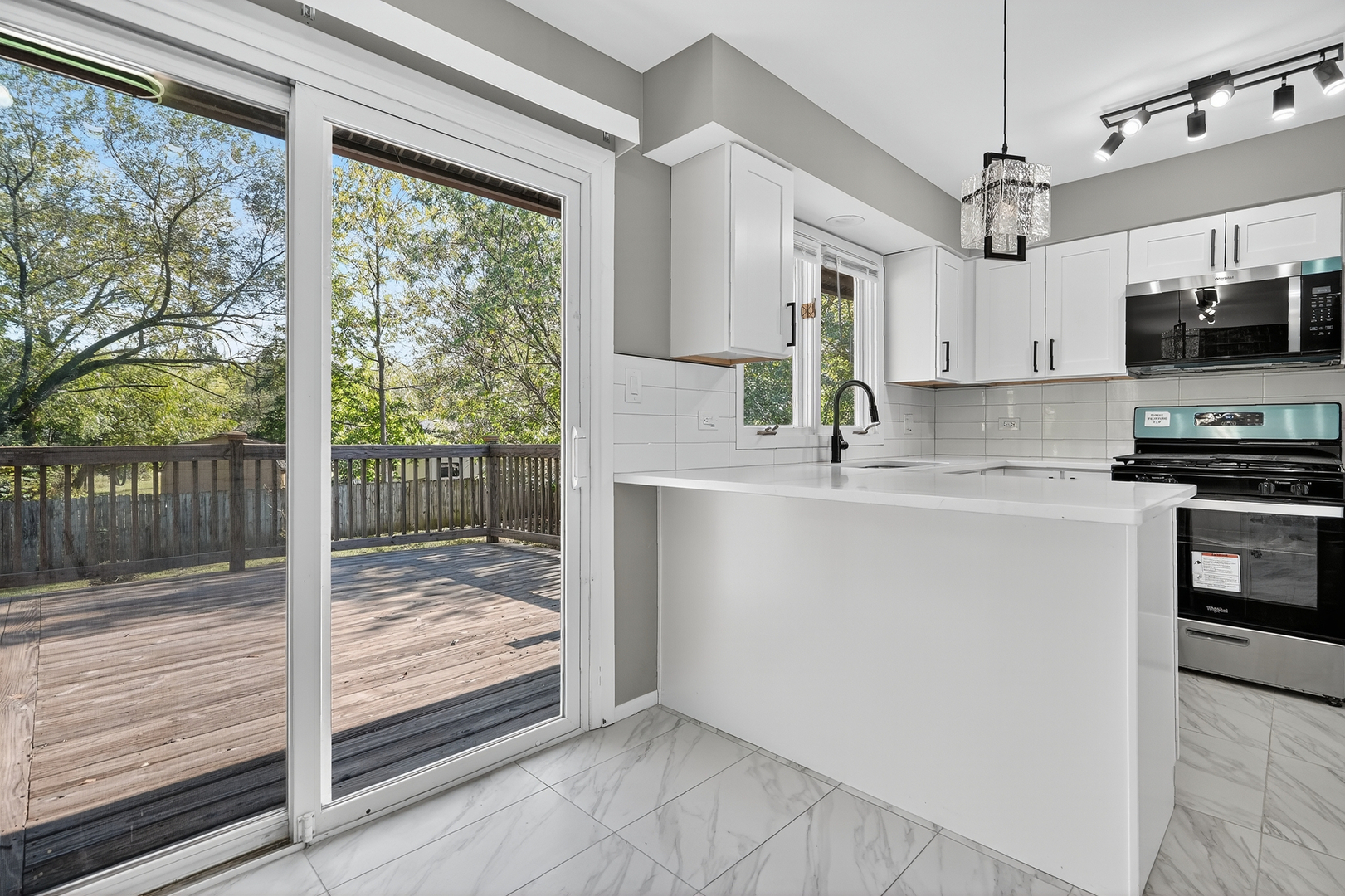 1245 Winaki Trail Algonquin, IL 60102 - Photo 16 of 39 a kitchen with kitchen island a counter top space a sink stainless steel appliances and cabinets