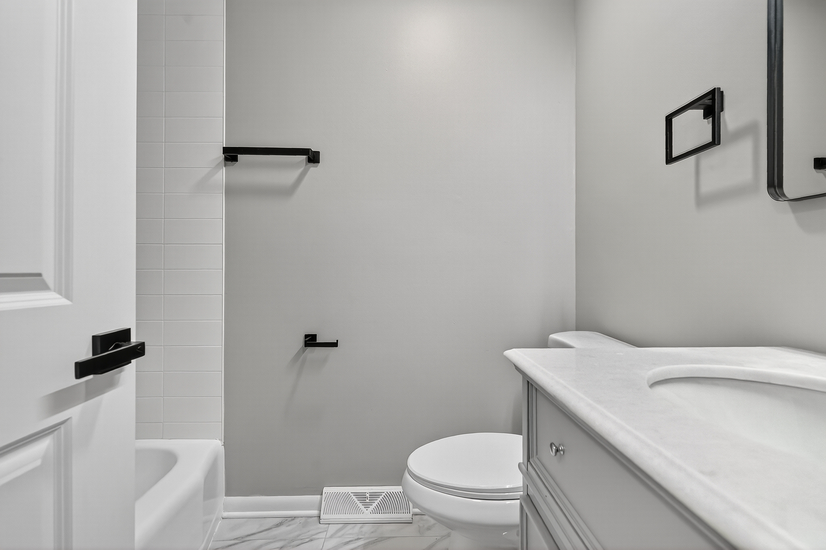 1245 Winaki Trail Algonquin, IL 60102 - Photo 22 of 39 a white toilet sitting next to a bathroom sink