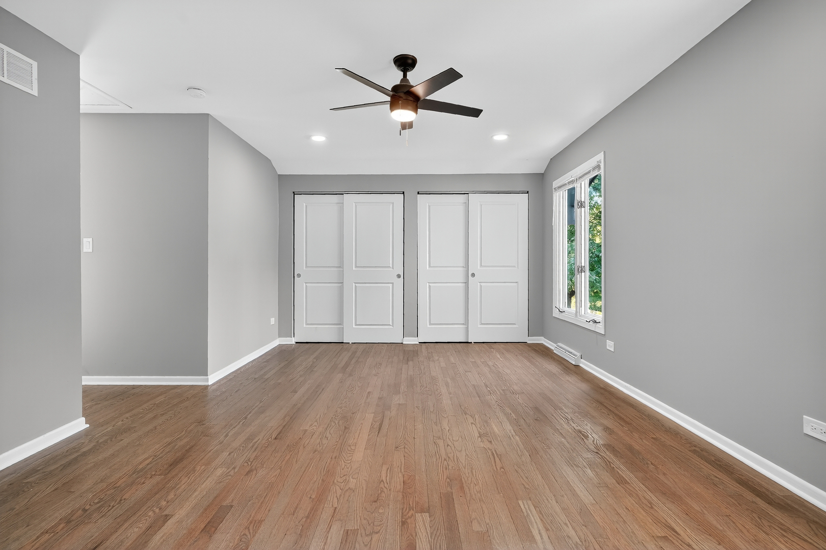1245 Winaki Trail Algonquin, IL 60102 - Photo 24 of 39 an empty room with wooden floor and windows