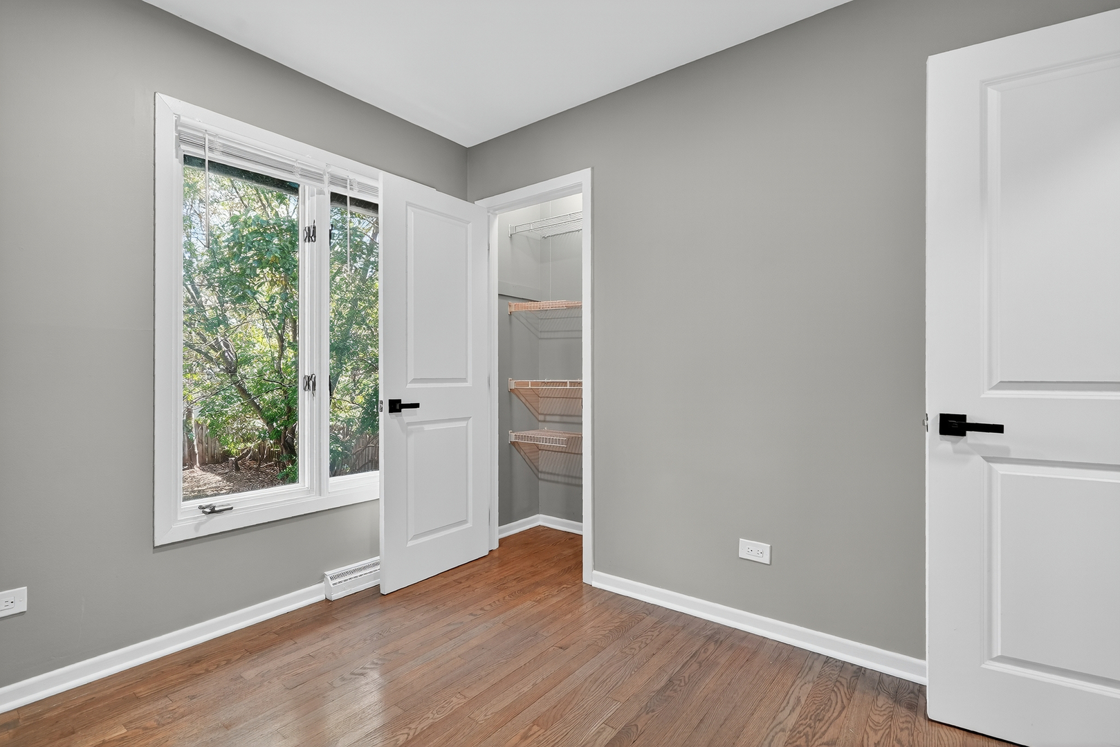 1245 Winaki Trail Algonquin, IL 60102 - Photo 30 of 39 an empty room with wooden floor and windows