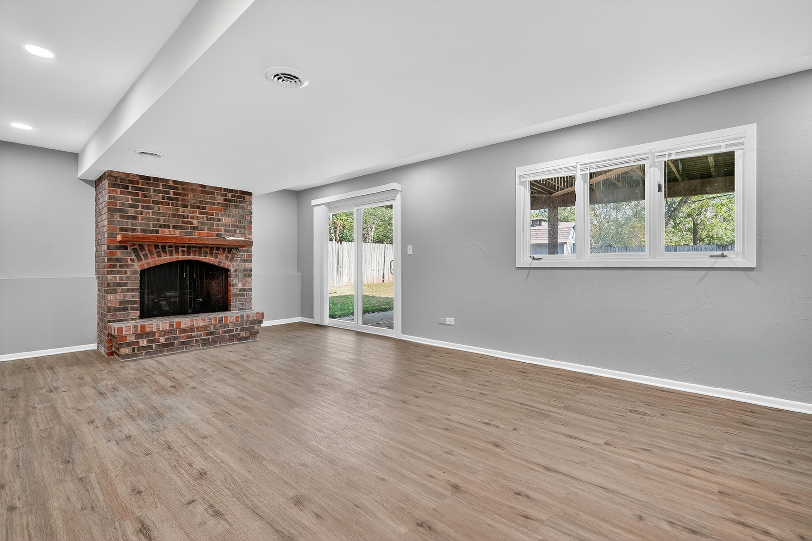1245 Winaki Trail Algonquin, IL 60102 - Photo 32 of 39 a view of an empty room with wooden floor and a window