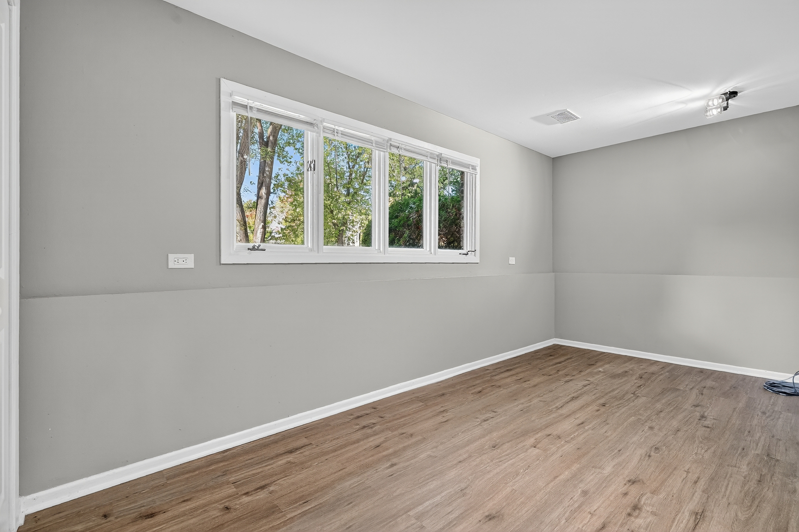 1245 Winaki Trail Algonquin, IL 60102 - Photo 33 of 39 a view of an empty room with wooden floor and a window