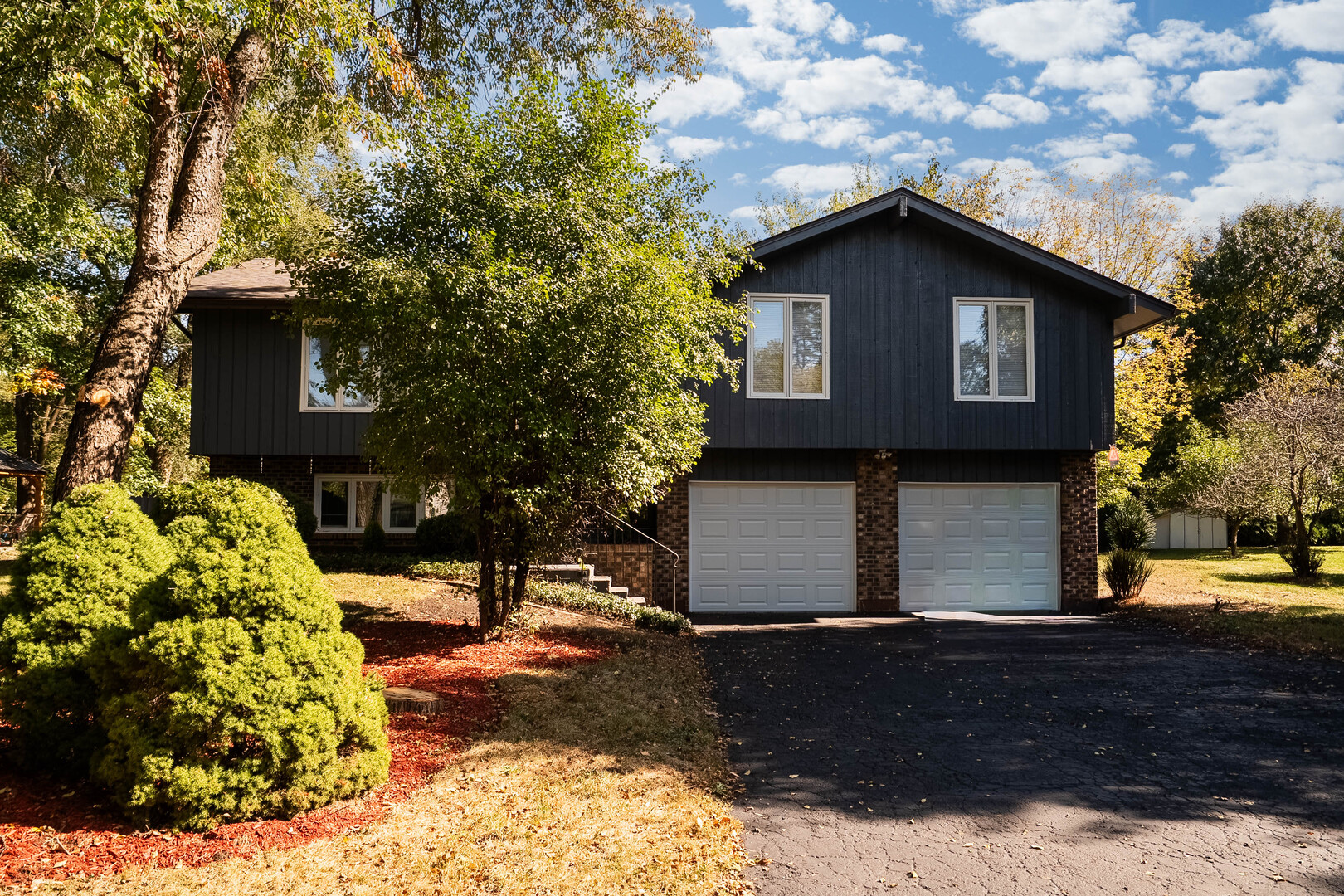1245 Winaki Trail Algonquin, IL 60102 - Photo 5 of 39 a front view of a house with garden