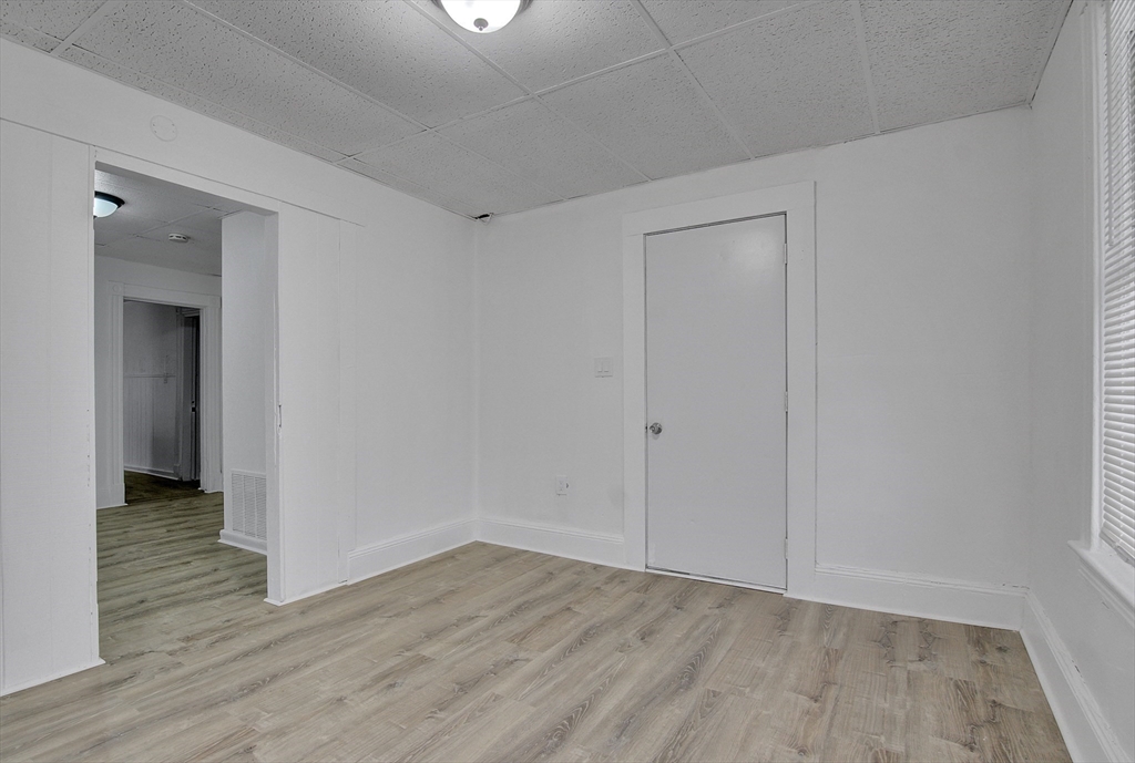 1397 Worcester Street, Unit 2 Springfield, MA 01151 - Photo 5 of 15 a view of an empty room with wooden floor
