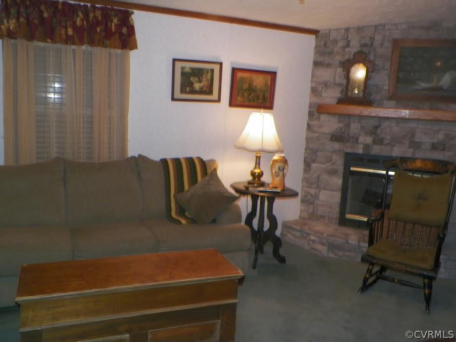 4619 Venable Road Kents Store, VA 23084 - Photo 8 of 21 a living room with furniture and a fireplace