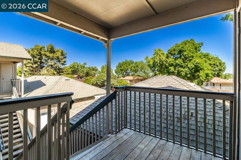 1123 Chadwick Circle Bay Point, CA 94565 - Photo 6 of 26 a view of a balcony with chair and wooden floor