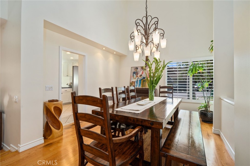 49 Pinewood, Unit 25 Irvine, CA 92604 - Photo 13 of 42 a view of a dining room with furniture window and wooden floor