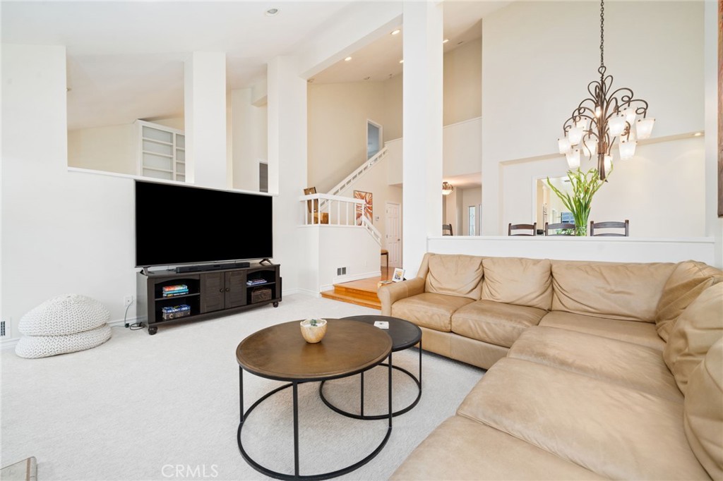 49 Pinewood, Unit 25 Irvine, CA 92604 - Photo 16 of 42 a living room with furniture and a flat screen tv
