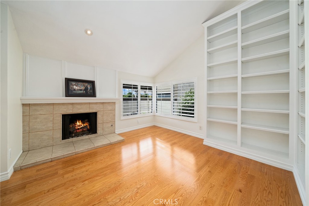 49 Pinewood, Unit 25 Irvine, CA 92604 - Photo 17 of 42 a view of an empty room with a fireplace and a window