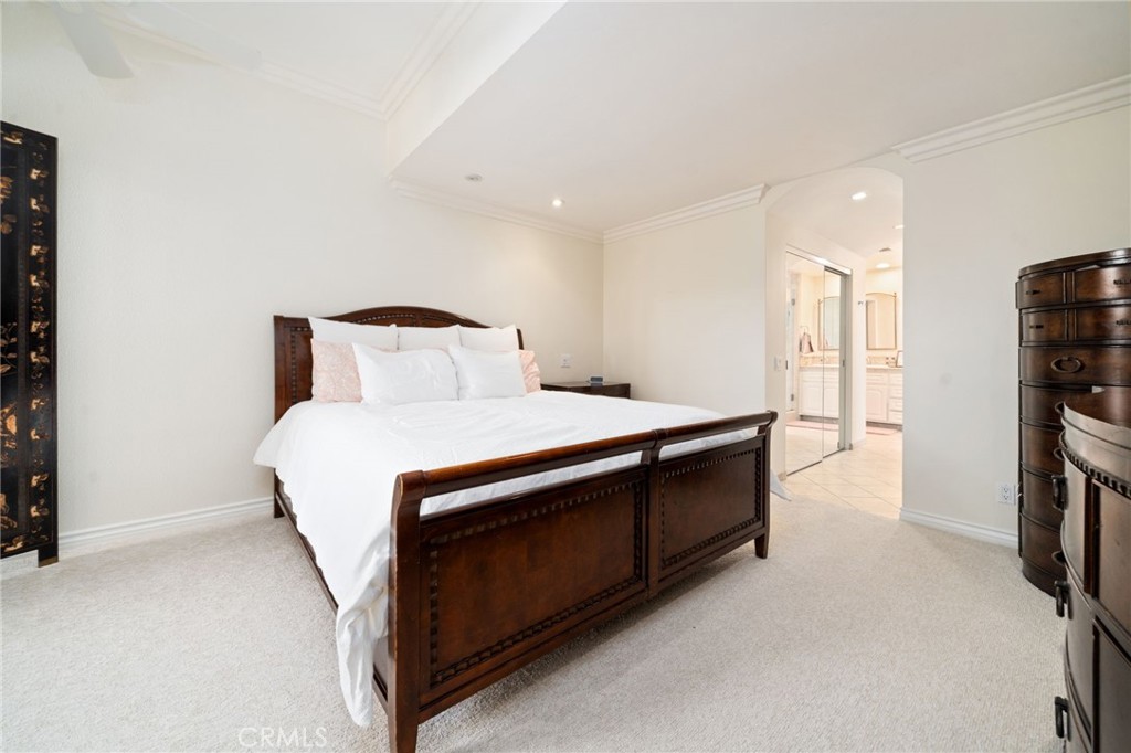 49 Pinewood, Unit 25 Irvine, CA 92604 - Photo 20 of 42 a bedroom with a bed and a tv in it