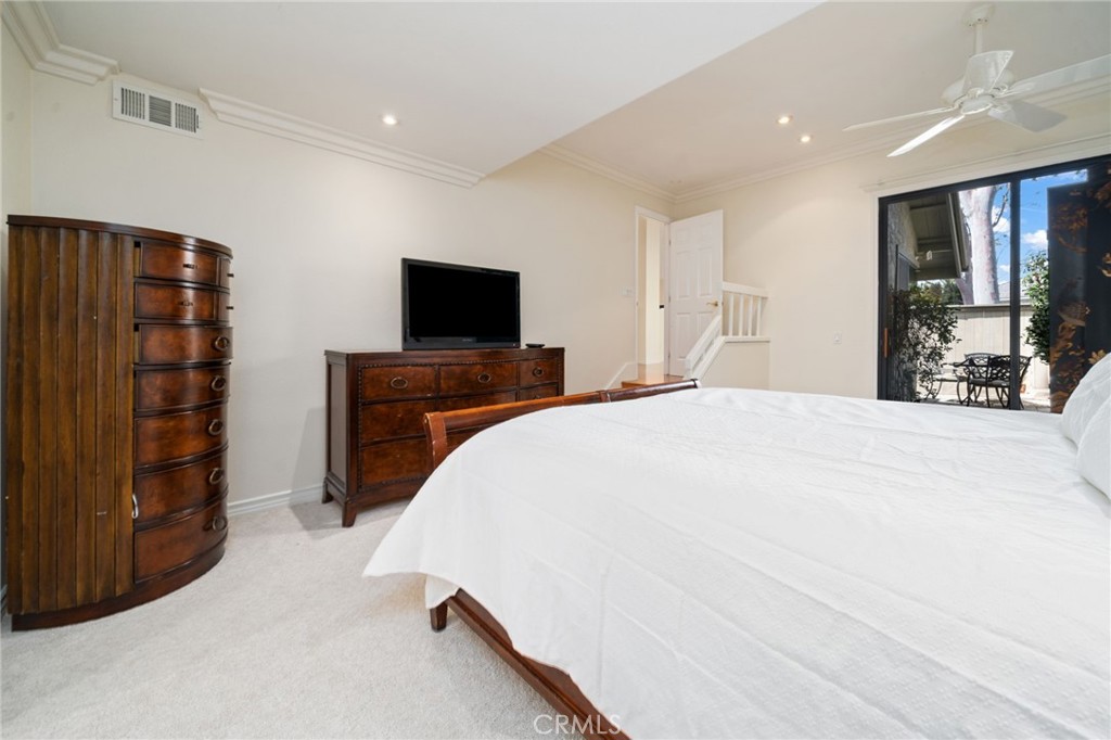 49 Pinewood, Unit 25 Irvine, CA 92604 - Photo 21 of 42 a bedroom with a bed and a television