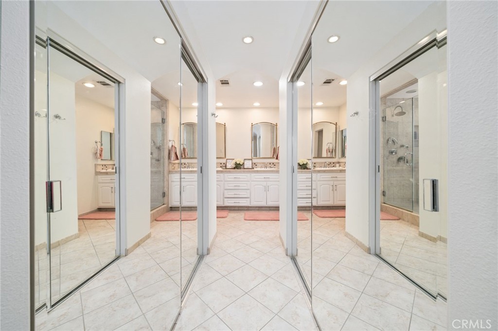 49 Pinewood, Unit 25 Irvine, CA 92604 - Photo 22 of 42 a bathroom with a glass shower door and a glass door shower