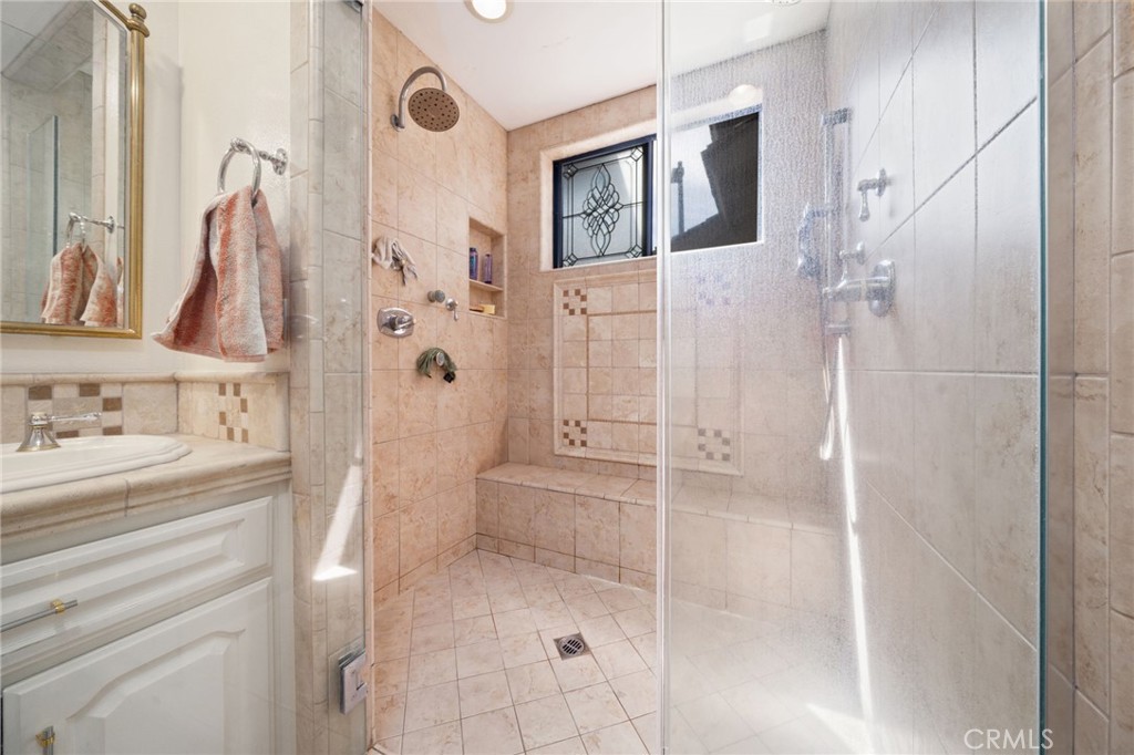 49 Pinewood, Unit 25 Irvine, CA 92604 - Photo 23 of 42 a bathroom with a shower and a mirror