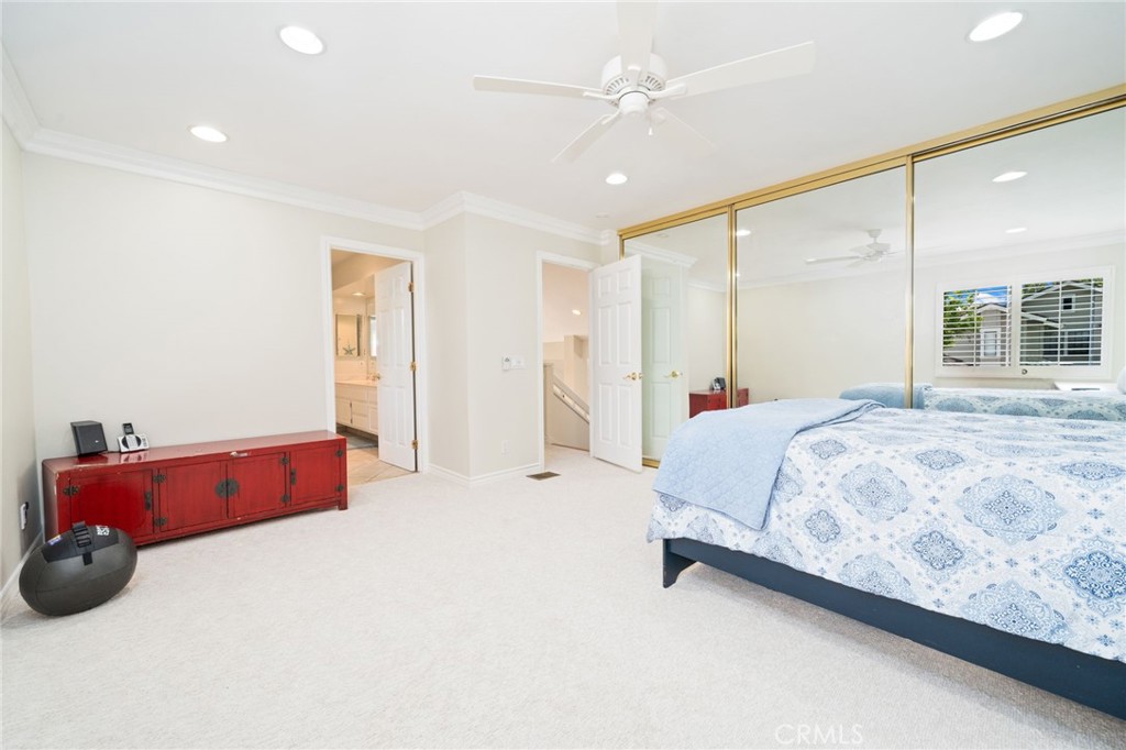 49 Pinewood, Unit 25 Irvine, CA 92604 - Photo 28 of 42 a bed room with a bed and a large window