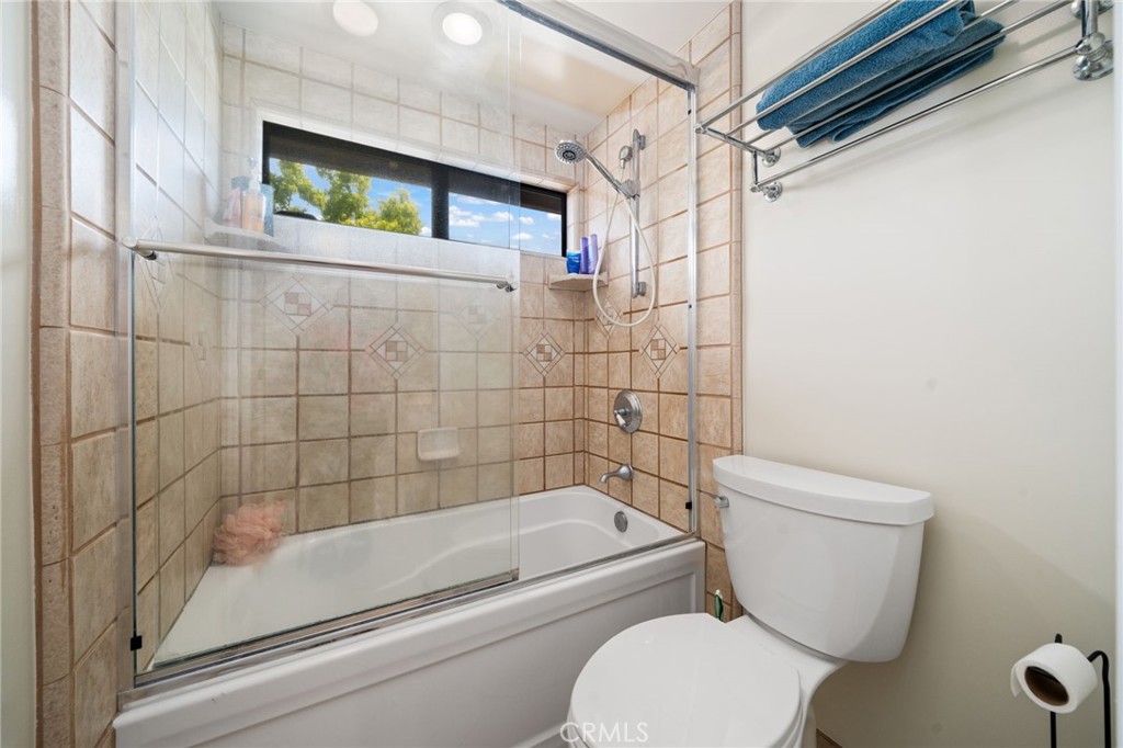 49 Pinewood, Unit 25 Irvine, CA 92604 - Photo 30 of 42 a bathroom with a toilet and shower
