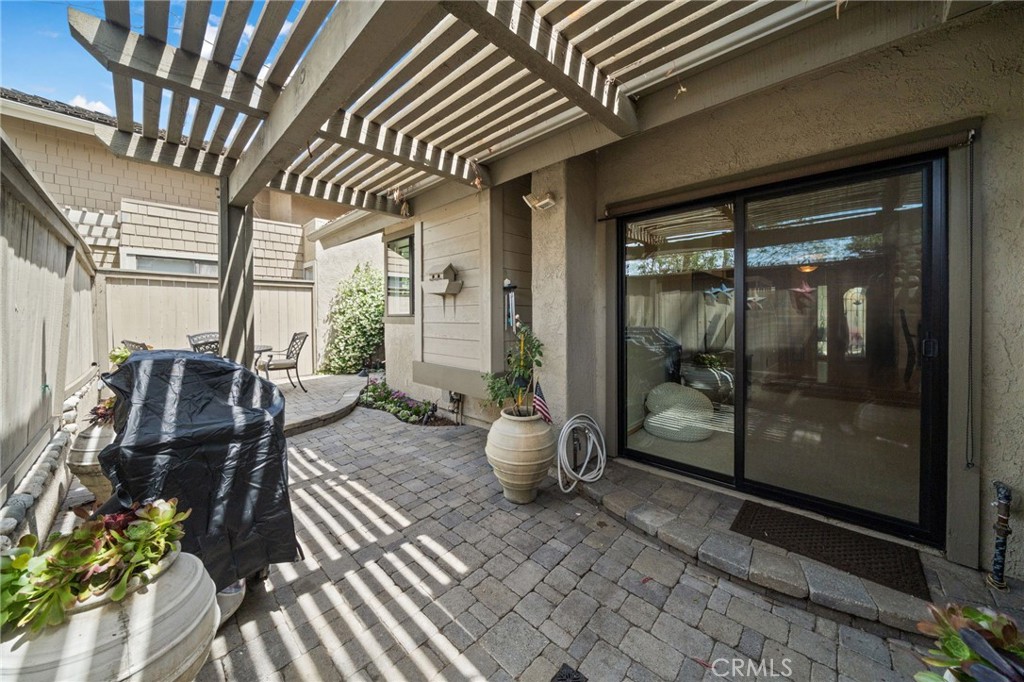 49 Pinewood, Unit 25 Irvine, CA 92604 - Photo 32 of 42 a view of a porch with chairs and potted plant